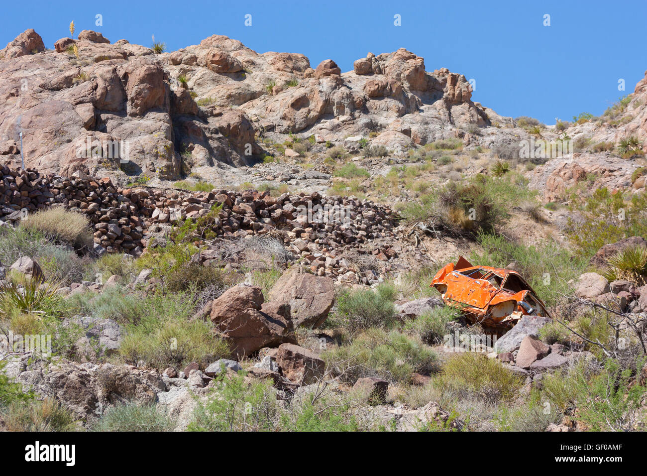 A wrecked car on a mountainside in Arizona Stock Photo