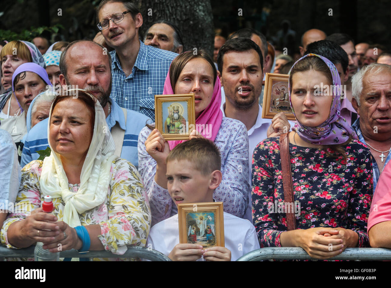 Ukrainian orthodox believers, priests, monks attend a religion march organized by the Ukrainian Orthodox Church of the Moscow Patriarchate in Kyiv, Ukraine, 27 July 2016. Sacred processions of Moscow Patriarchate believers started earlier, in July 4 2016 and timed to the Day of the Christianization of Kyiv Rus and 1000 years of ancient monks on the Holy Mount Athos. On July 27 believers who have begun a course from Svyatogorsk Monastery in eastern Ukraine and from Pochayiv Monastery at the west of the country, met at the European Square in Kyiv. The main celebrations took place at Vladimir's Stock Photo