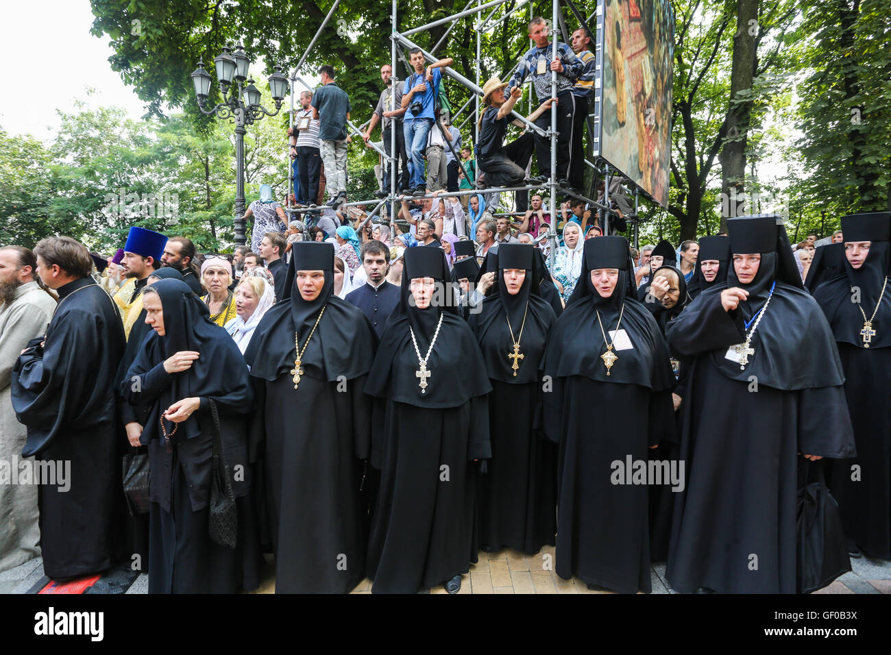 Ukrainian orthodox believers, priests, monks attend a religion march organized by the Ukrainian Orthodox Church of the Moscow Patriarchate in Kyiv, Ukraine, 27 July 2016. Sacred processions of Moscow Patriarchate believers started earlier, in July 4 2016 and timed to the Day of the Christianization of Kyiv Rus and 1000 years of ancient monks on the Holy Mount Athos. On July 27 believers who have begun a course from Svyatogorsk Monastery in eastern Ukraine and from Pochayiv Monastery at the west of the country, met at the European Square in Kyiv. The main celebrations took place at Vladimir's Stock Photo