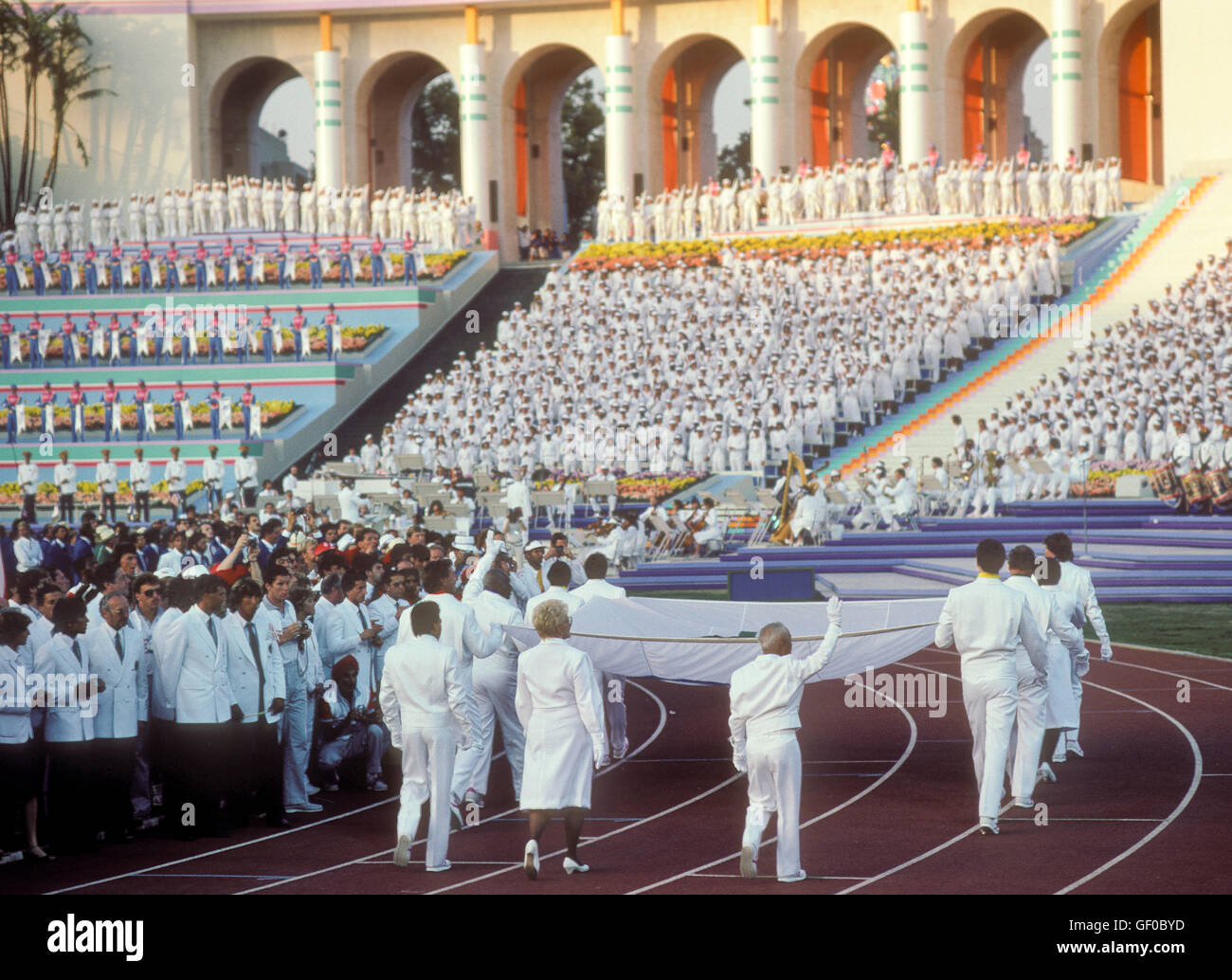 Olympic medalists carry and escort the Olympic flag in the Opening Ceremonies of the 1984 Olympic Games in Los Angeles. Stock Photo