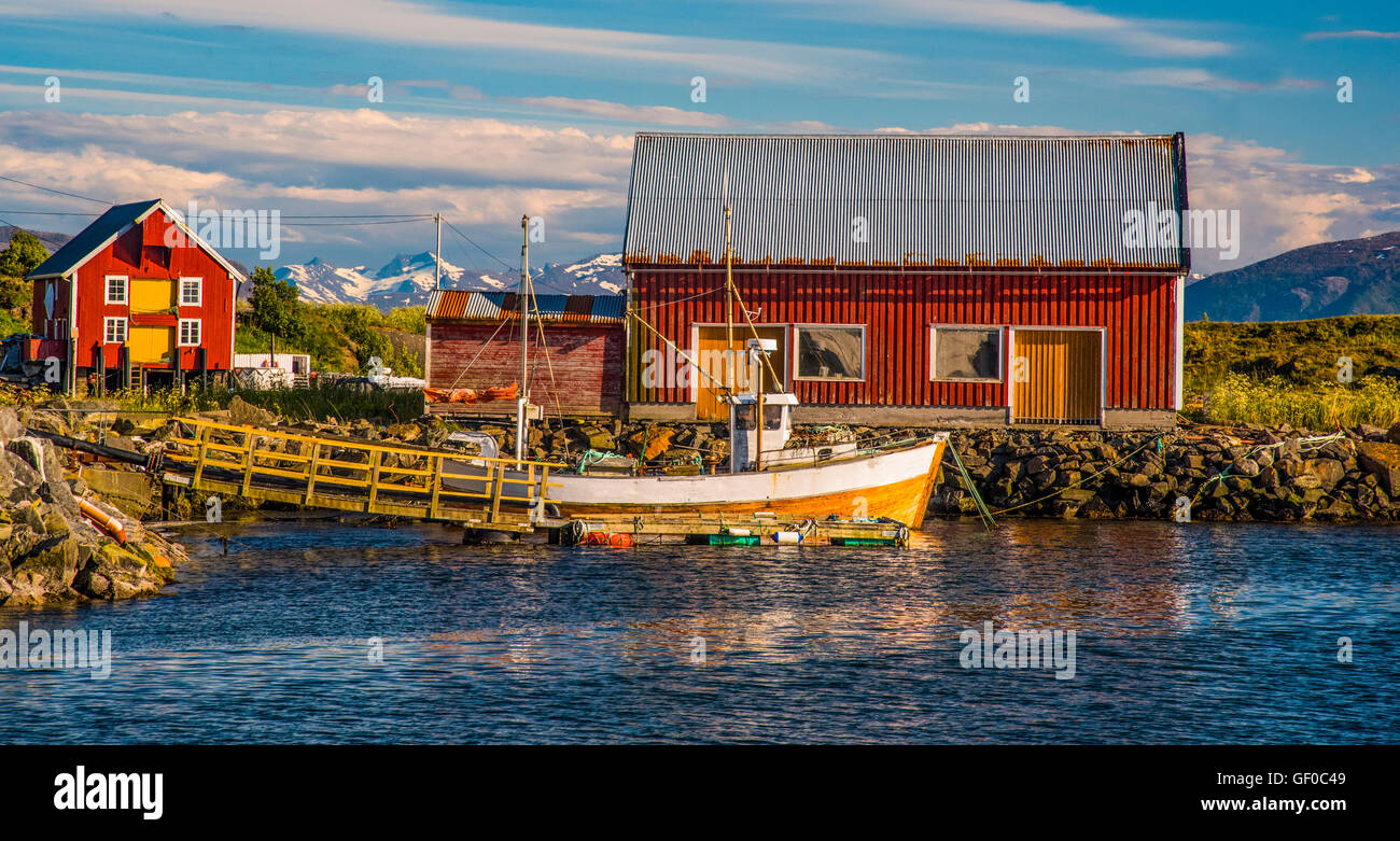 Colorful Fishing Boat and Boat House in Bay, Bud More and Romsdal area. West Coast, Norway, Scandanavia Stock Photo