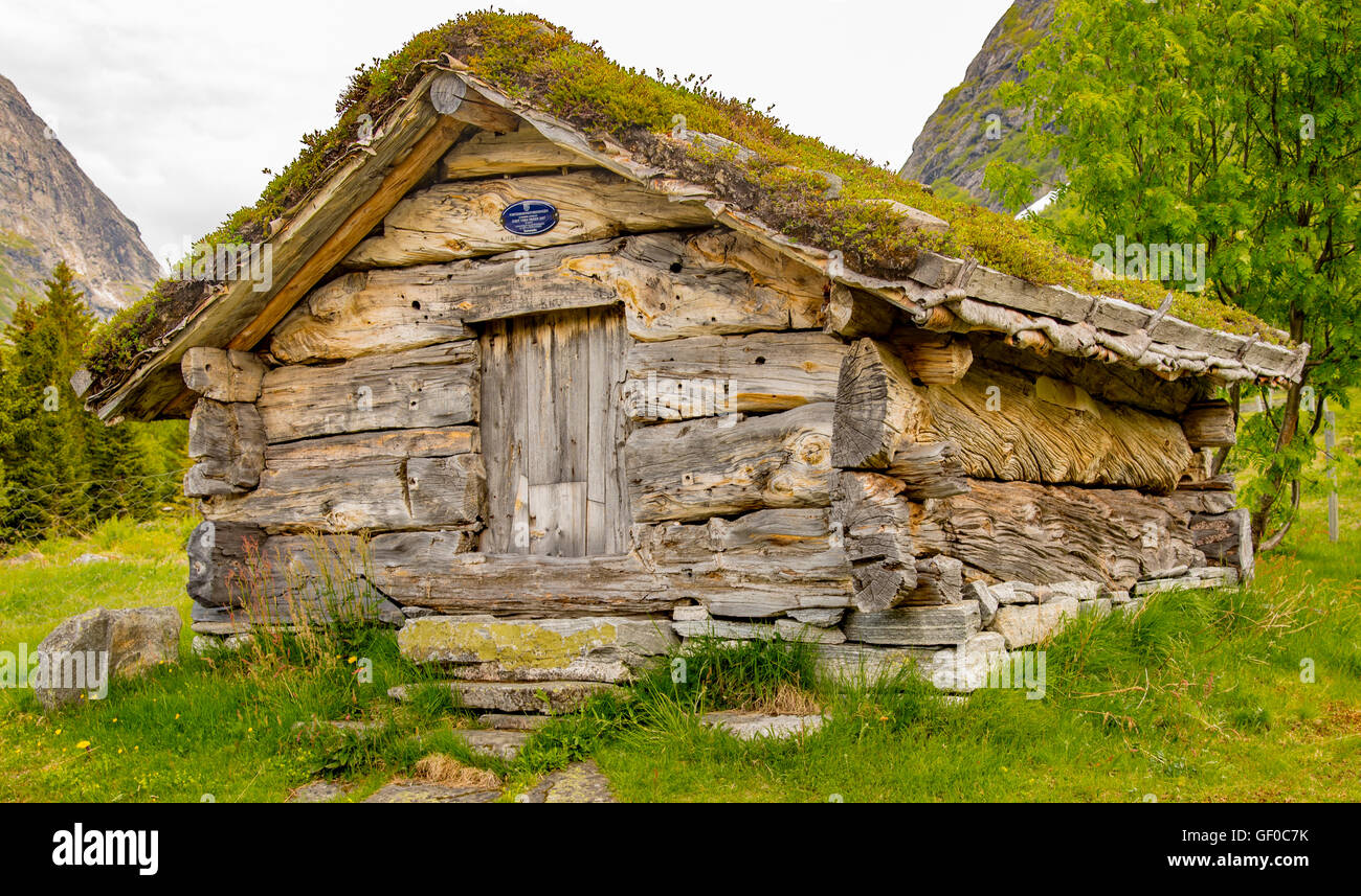 Historic Old Wooden Cabin with grass roof. Trollistigen, River Campsite, Reinheiman Nat. Park, Norway, Scandanavia, European Stock Photo