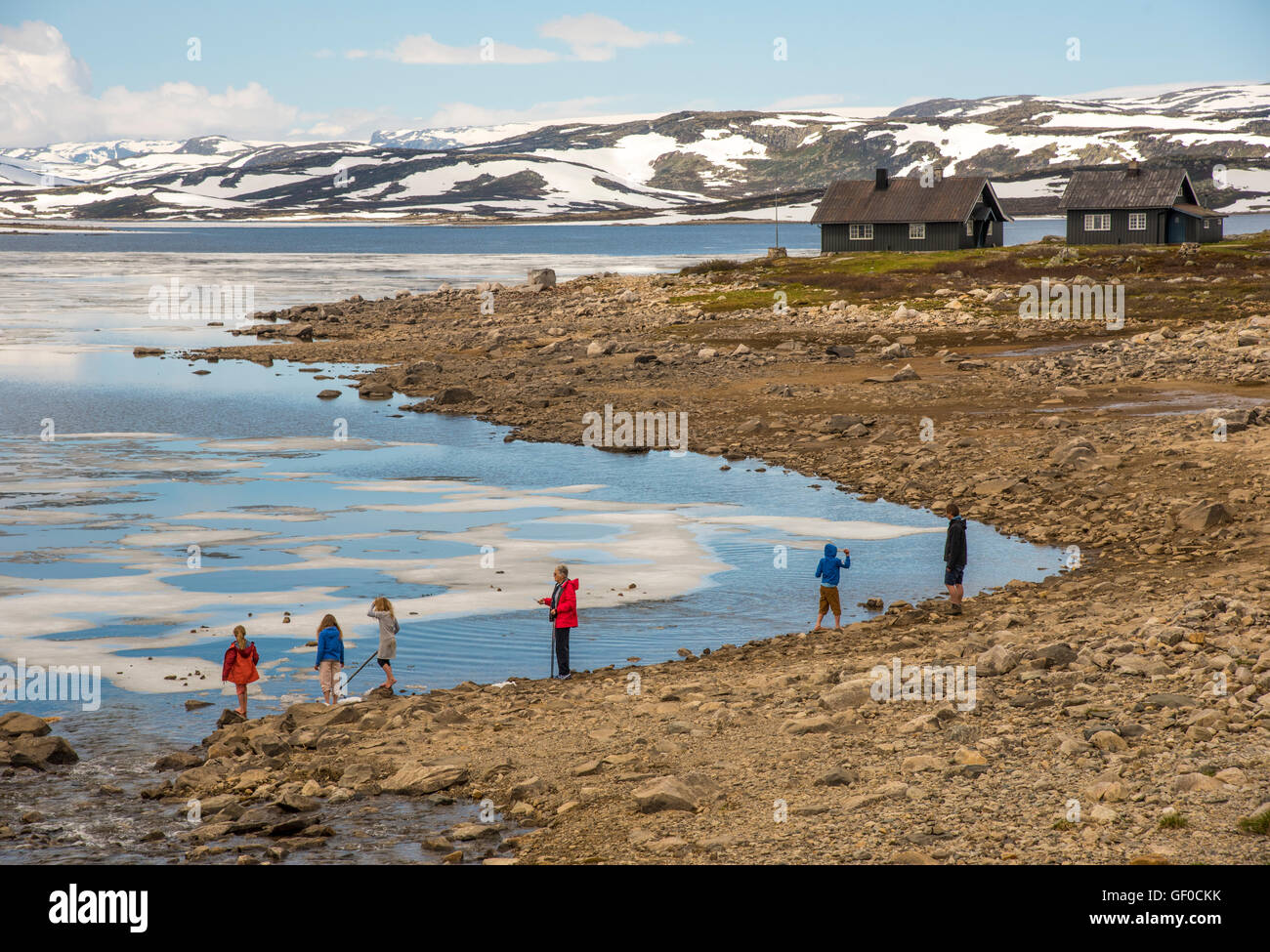 People enjoying Lake Orteren in springtime. Hardangervidda National Park, Norway, Hordaland, Scandinavia, European Stock Photo