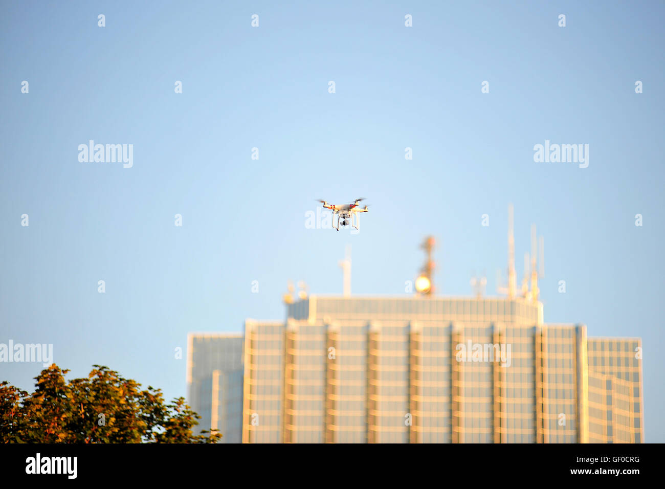 A drone flying in front of a skyscraper in the Canadian city of London, Ontario. Stock Photo