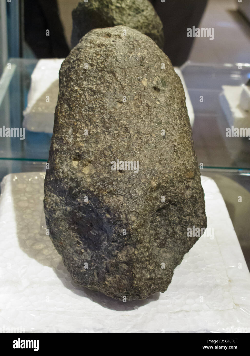 The stone showing the elongated human head can be found in the Paracas history museum Stock Photo