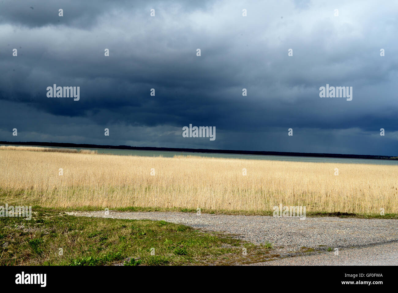Dark clouds, contrasting with water Stock Photo