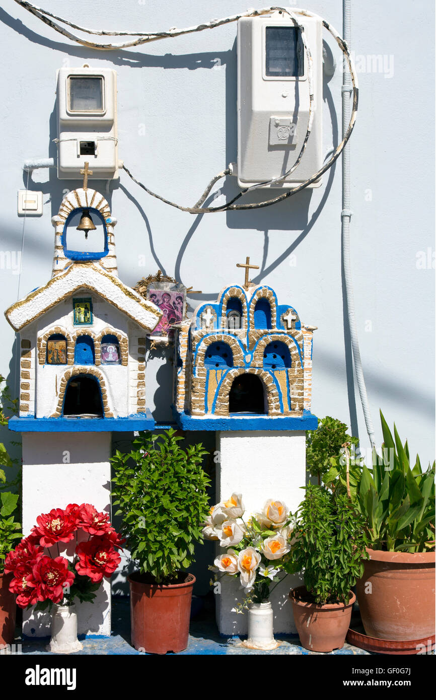 Greek Orthodox Shrines and flowers in the street of Paleochora, Crete, Greece Stock Photo