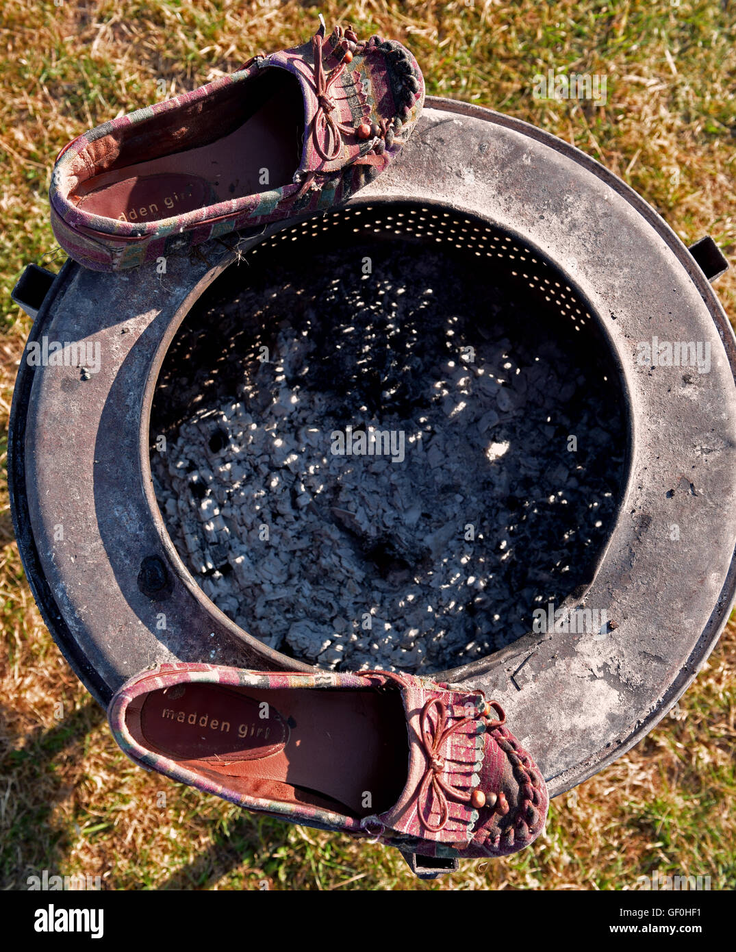 wet shoes drying by the camp fire Stock Photo Alamy