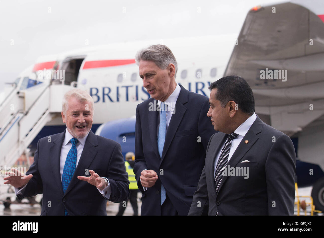 (Left-right) Declan Collier CEO of London City Airport, Chancellor Phillip Hammond and Minister for Aviation Lord Ahmad during a visit to London City Airport, as a &Acirc;£344 million expansion programme at the airport has been given the go-ahead by ministers who hope it could provide a &Acirc;£1.5 billion boost to the British economy by 2025. Stock Photo