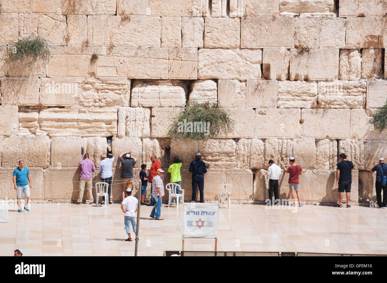 Jerusalem: Jews praying at the Western Wall, the Wailing Wall or Kotel, a surviving remnant of the Temple Mount, the holiest place for Hebraism Stock Photo