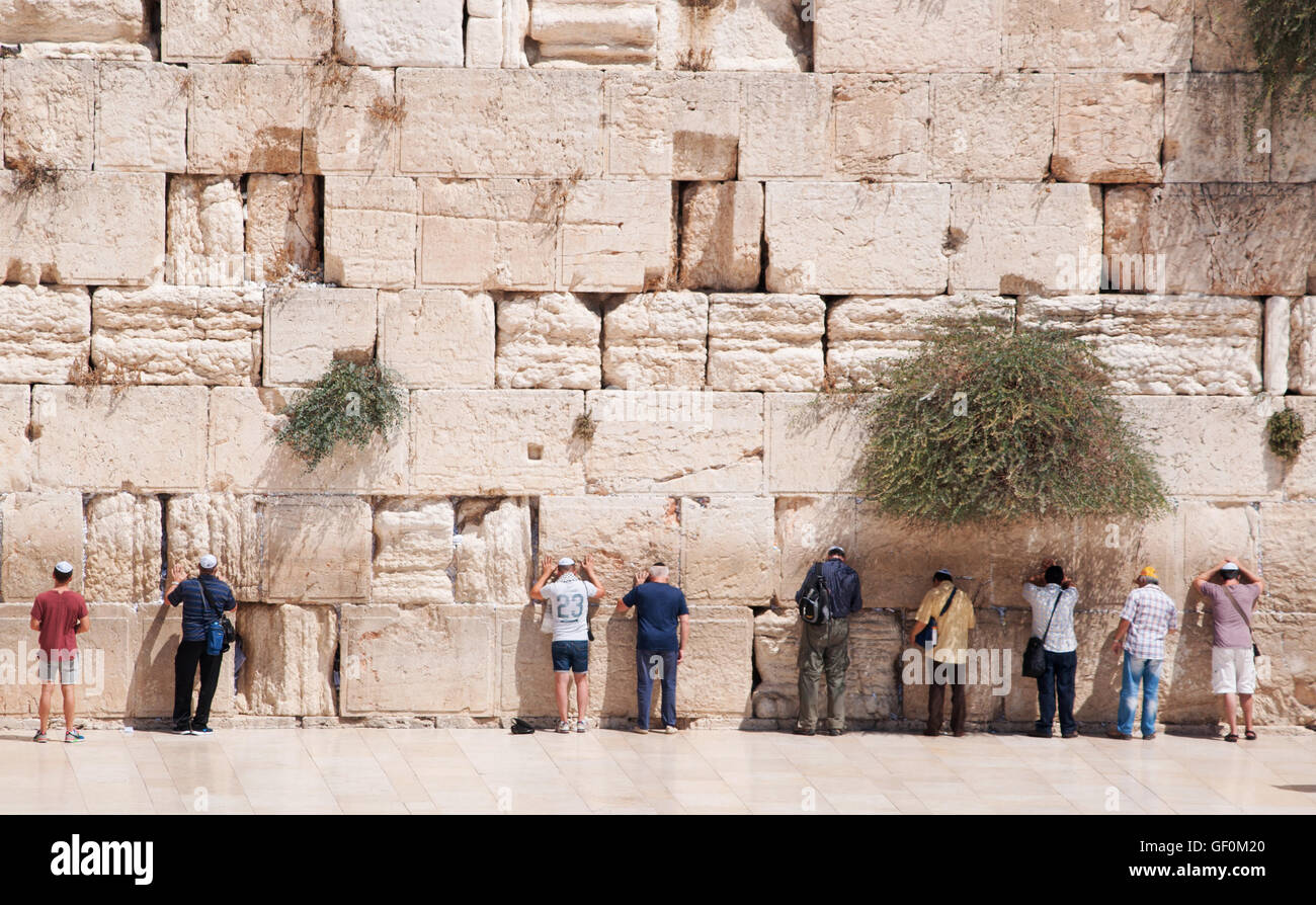Jerusalem: Jews praying at the Western Wall, the Wailing Wall or Kotel, a surviving remnant of the Temple Mount, the holiest place for Hebraism Stock Photo