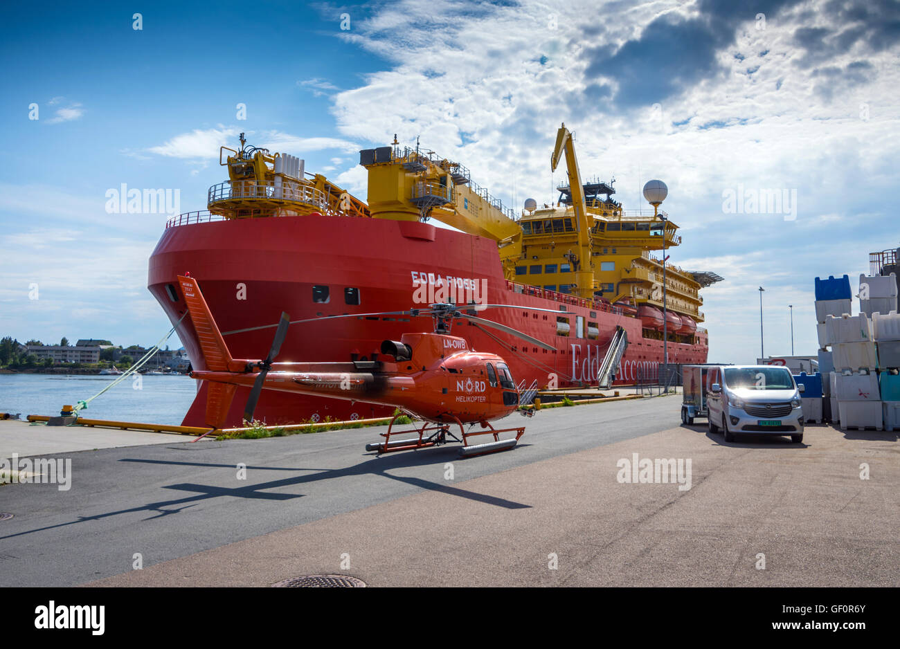 Edda Fides flotel, Accommodation ship for the oil industry, big red ship with red Nord helicopter Stock Photo