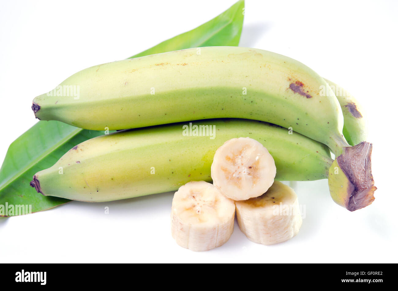 Banana (Other names are Musa banana acuminata, Musa balbisiana, and Musa x paradisiaca) fruit with leaf isolated on white Stock Photo