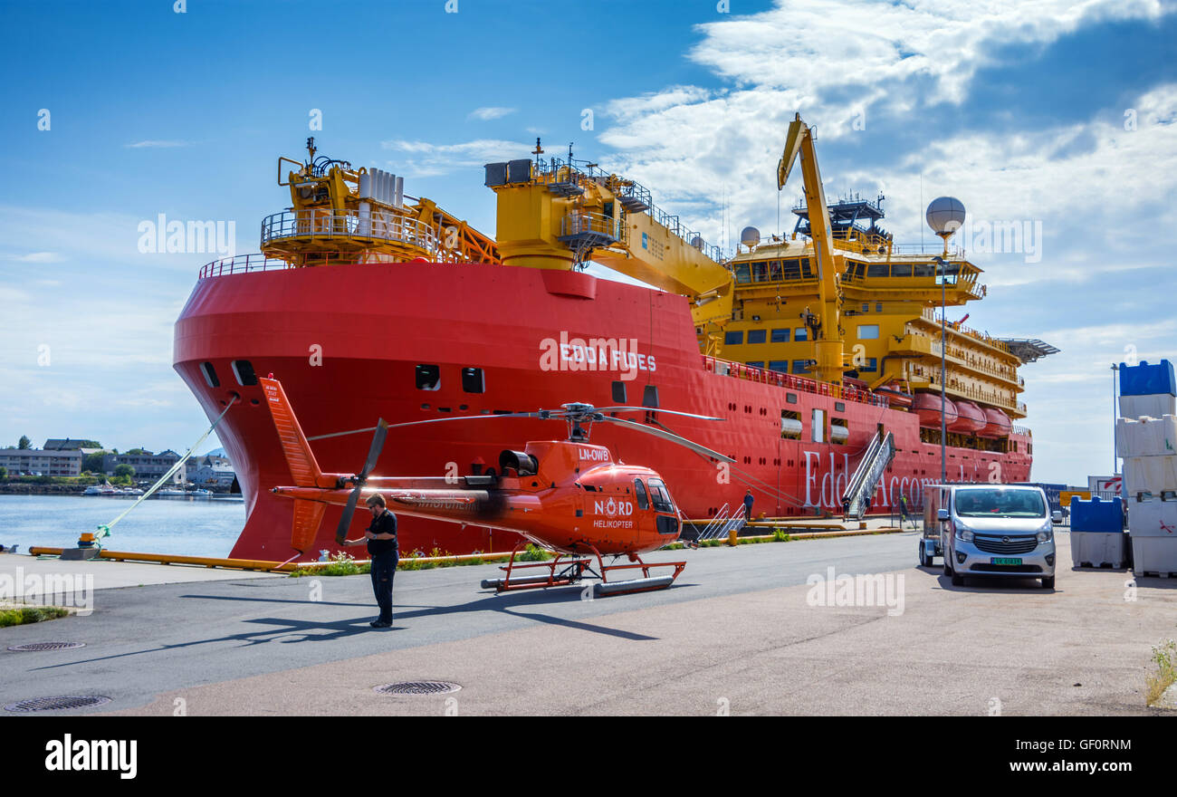 Edda Fides flotel, Accommodation ship for the oil industry, big red ship, with red Nord Helicopter Stock Photo