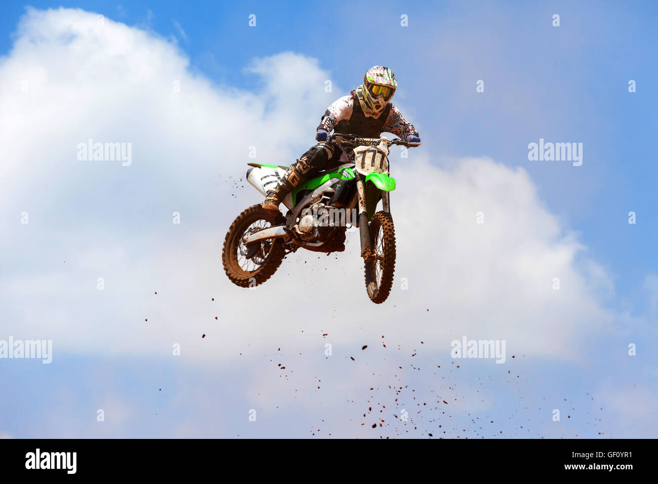 Motocross rider and bike clearing a tabletop jump during the final heat