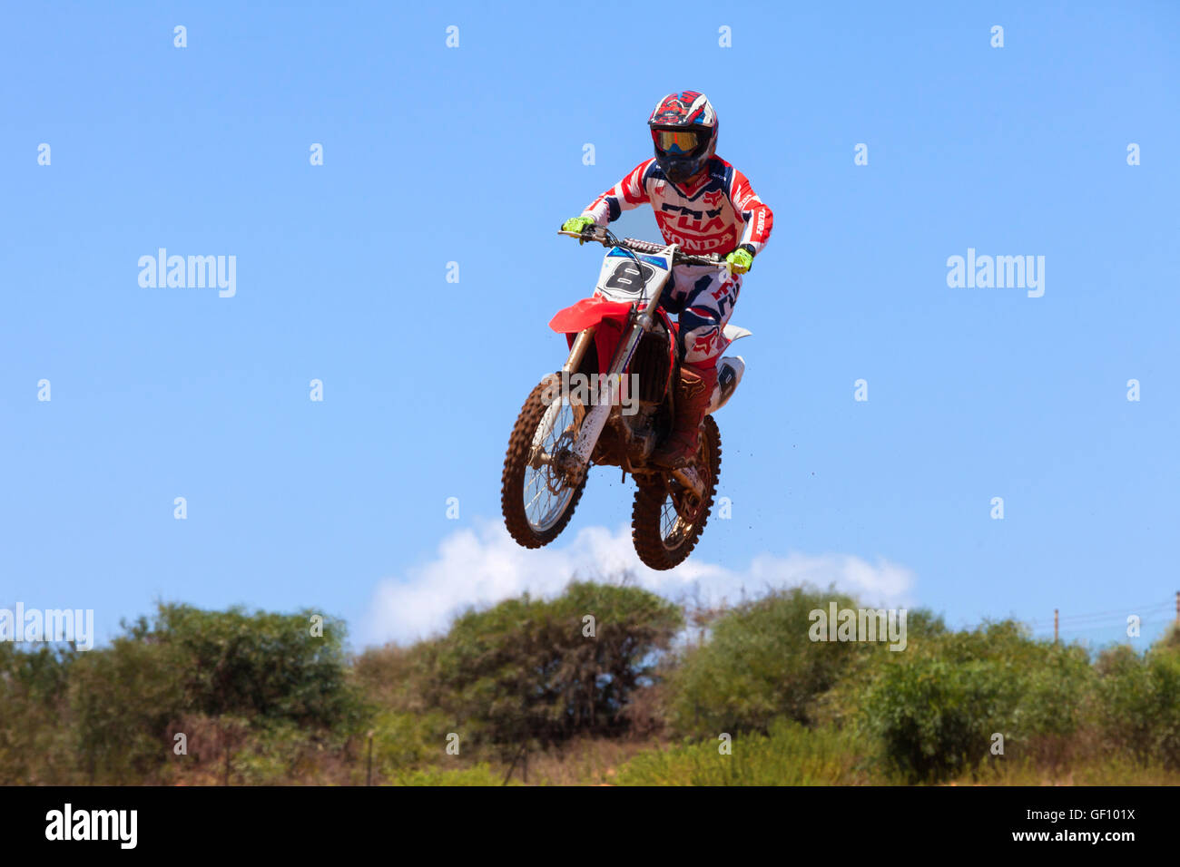 Motocross rider and bike clearing a tabletop jump during the final heat