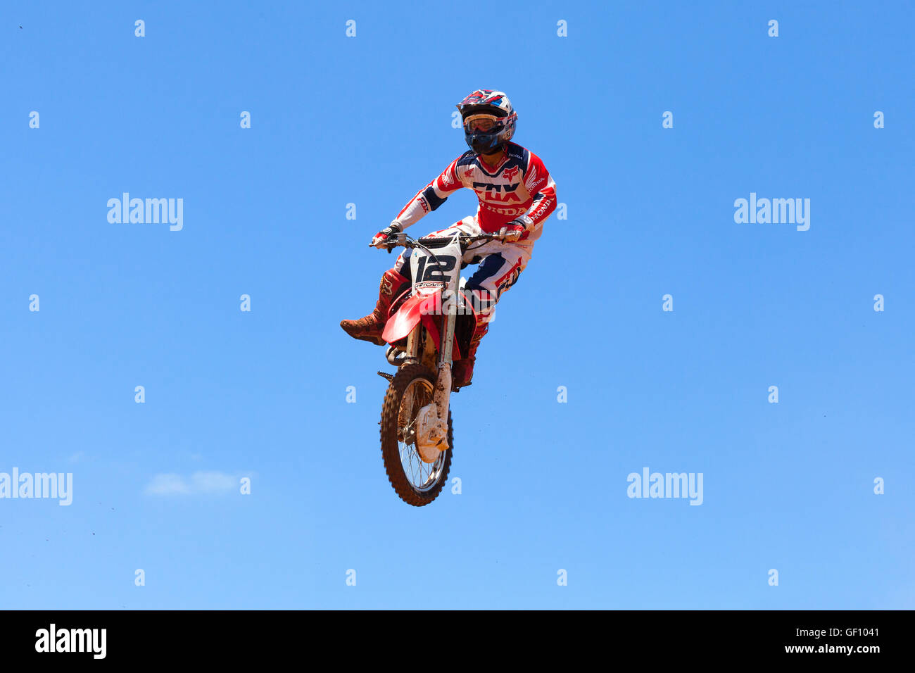 Motocross rider and bike clearing a tabletop jump during the final heat