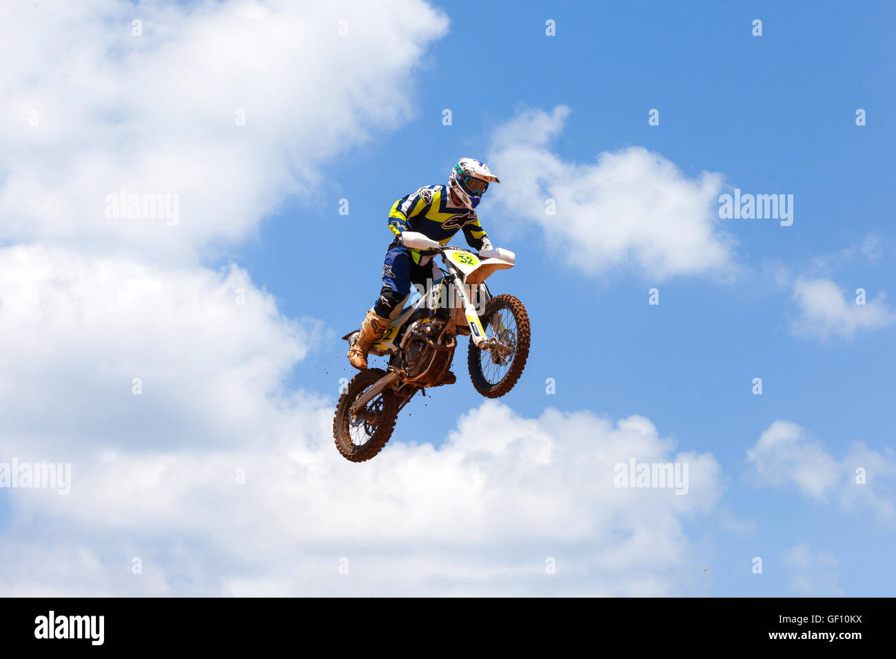 Motocross rider and bike clearing a tabletop jump during the final heat