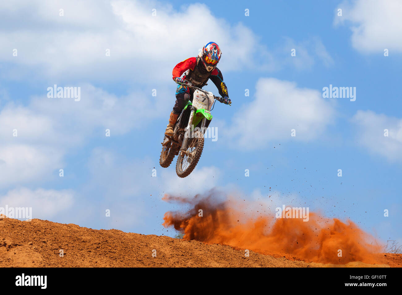 Motocross rider and bike clearing a tabletop jump during the final heat
