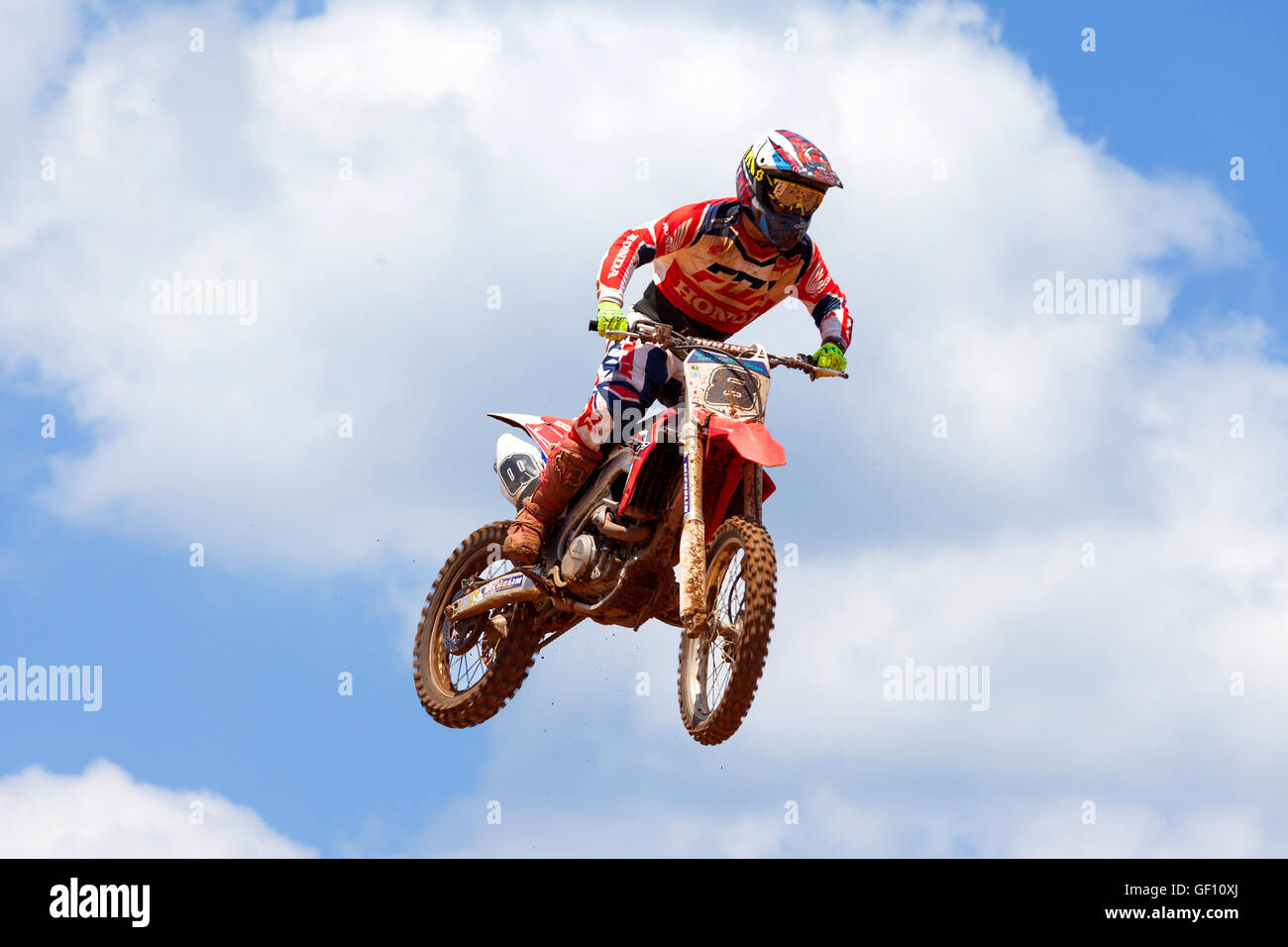 Motocross rider and bike clearing a tabletop jump during the final heat