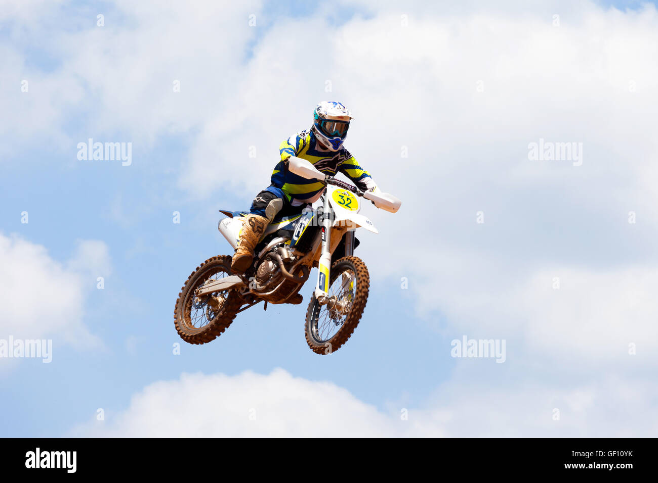 Motocross rider and bike clearing a tabletop jump during the final heat