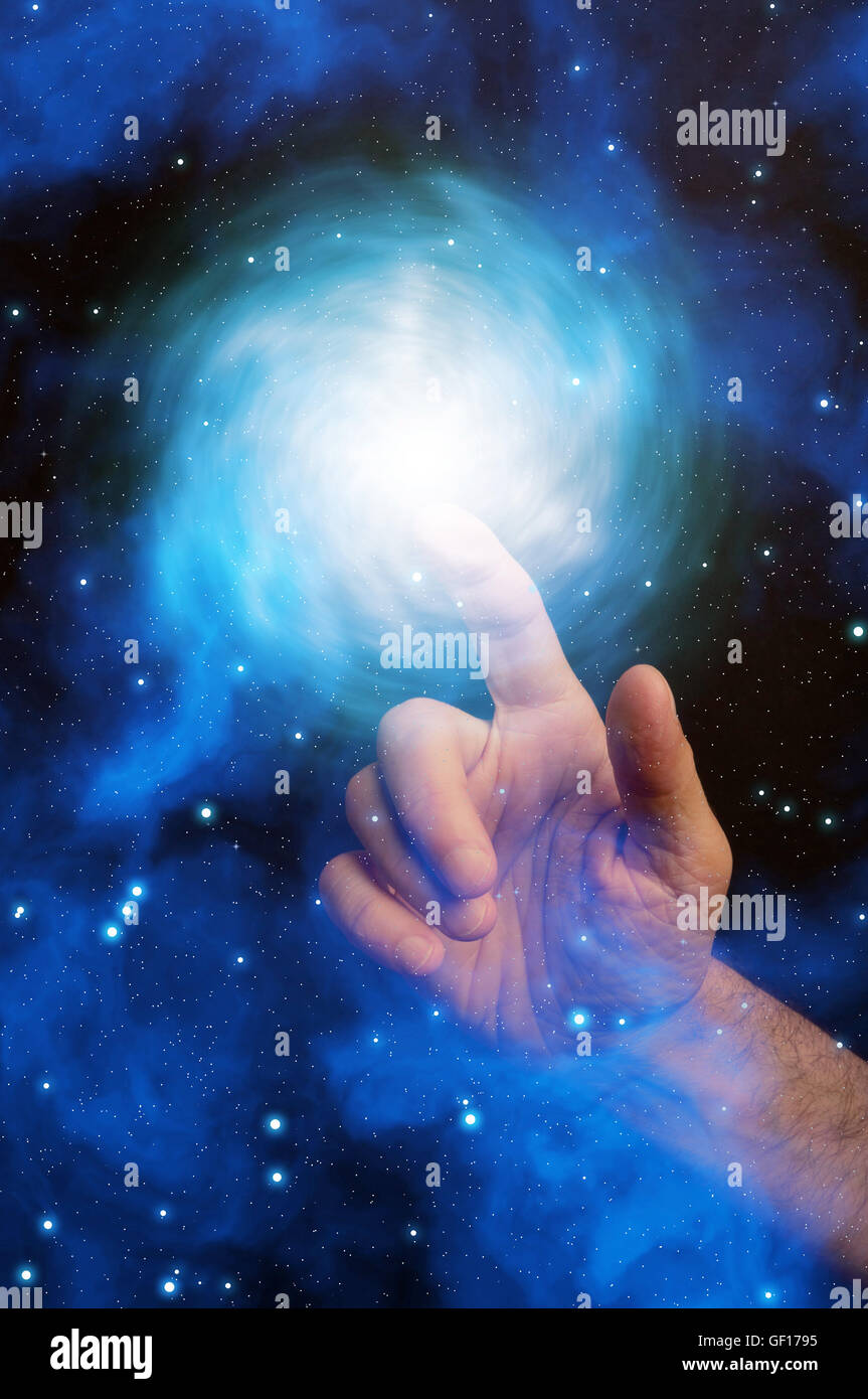 woman hand touching a nebulae in the space Stock Photo