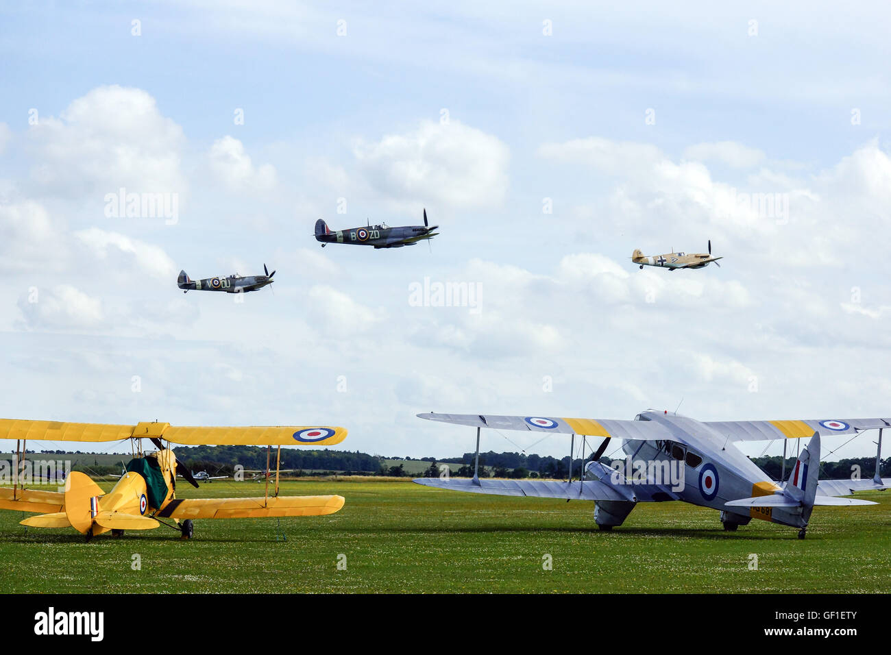 2 Spitfires and a ME 109 taking off from RAF Duxford,Flying Legends Stock Photo