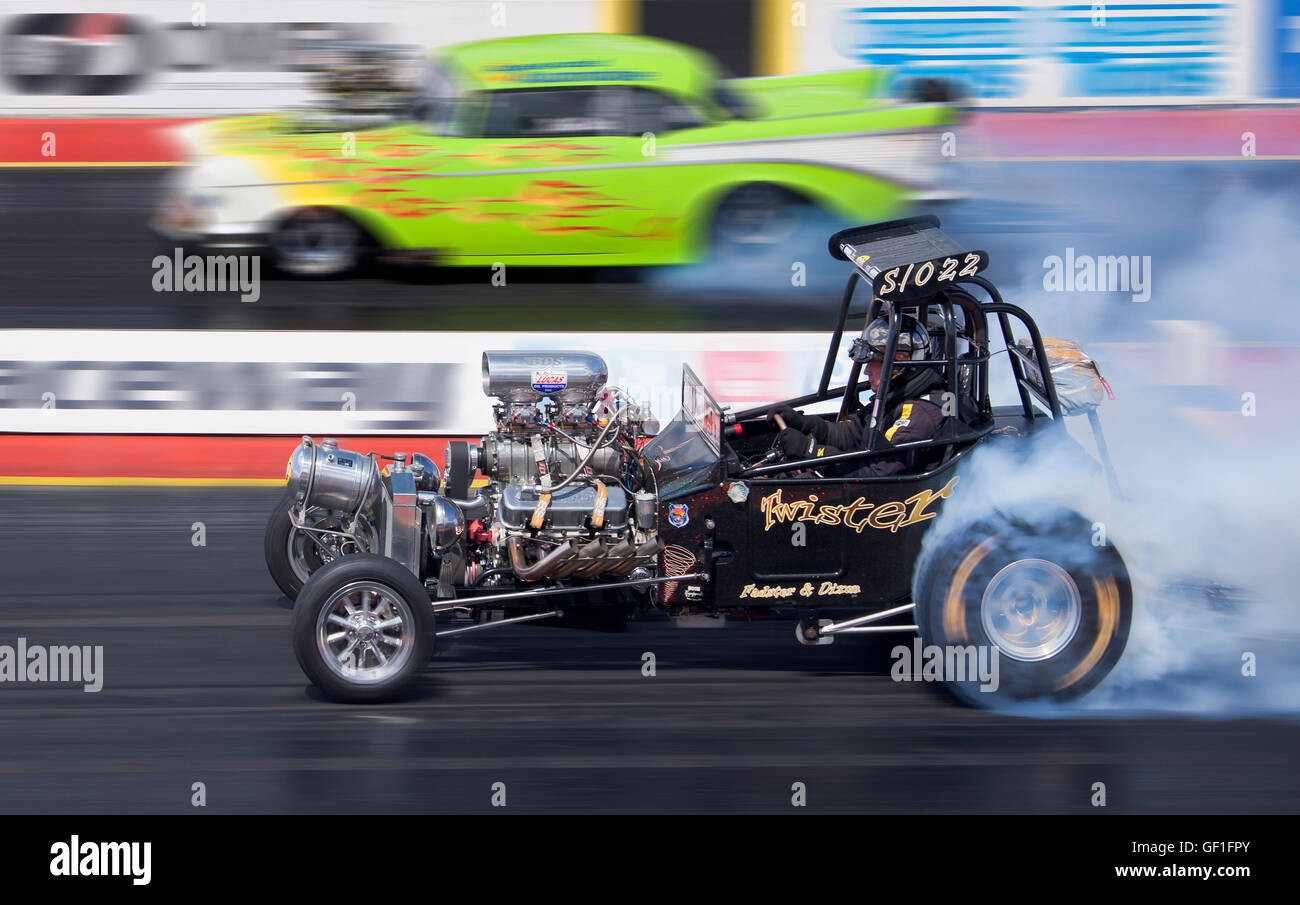 Dragstalgia vintage cars racing at Santa Pod. Andy Hadfield driving his Ford T Bucket Supercharged Outlaw. Stock Photo