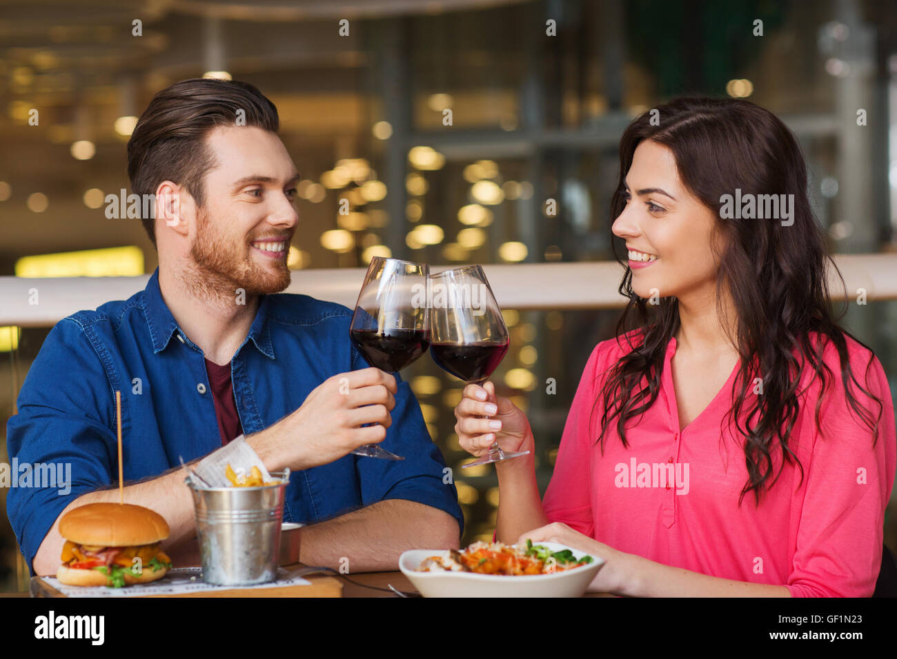 happy couple dining and drink wine at restaurant Stock Photo