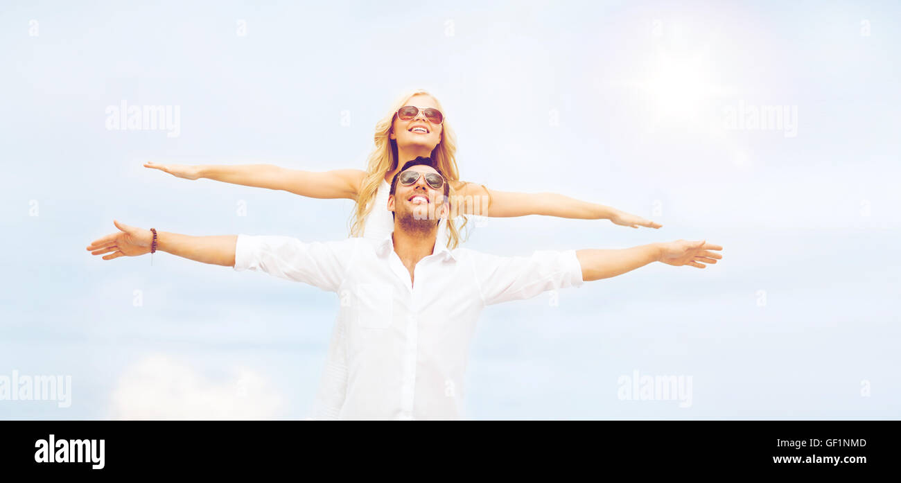 couple holding hands up at sea side Stock Photo - Alamy