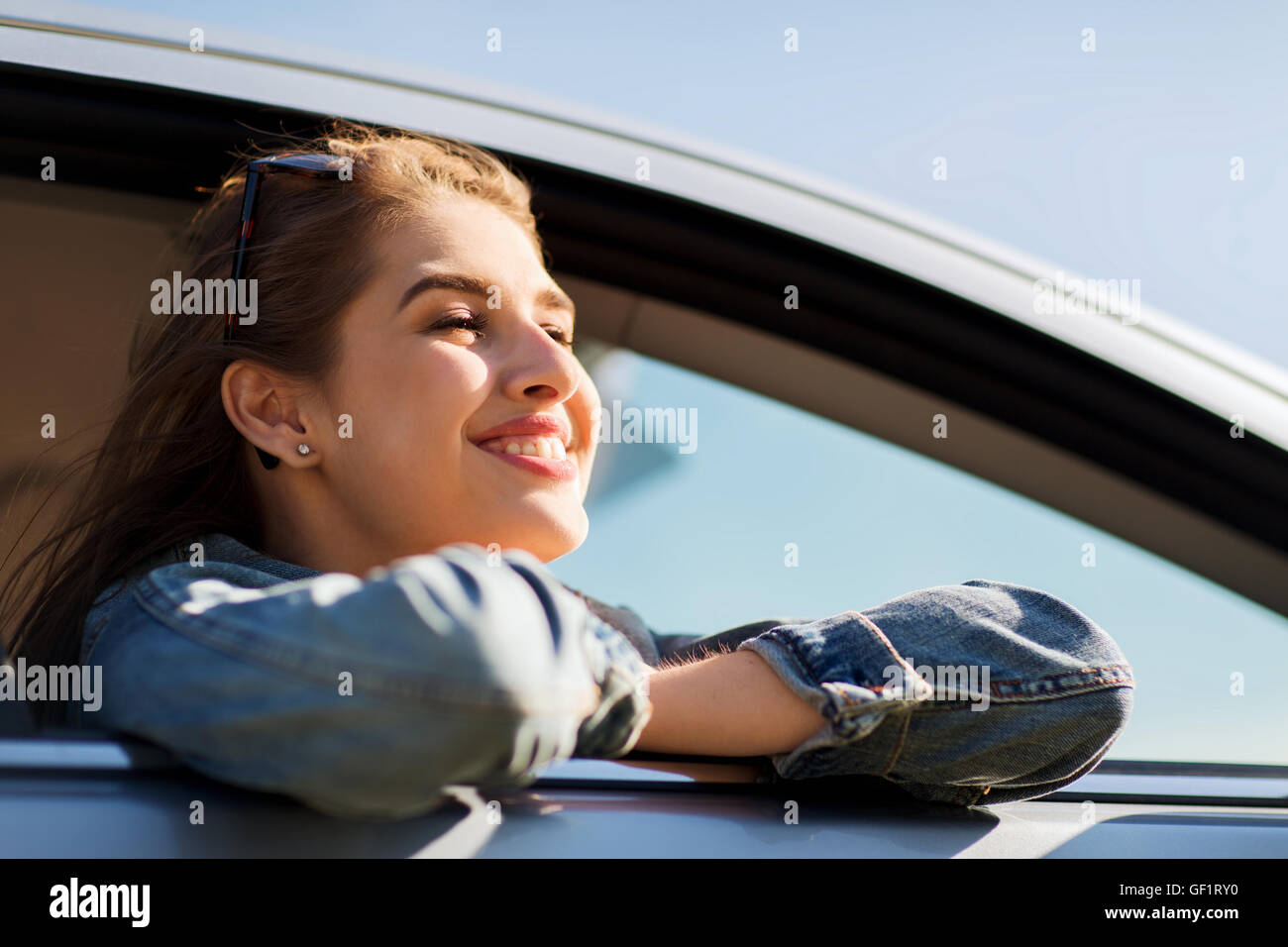 happy teenage girl or young woman in car Stock Photo - Alamy