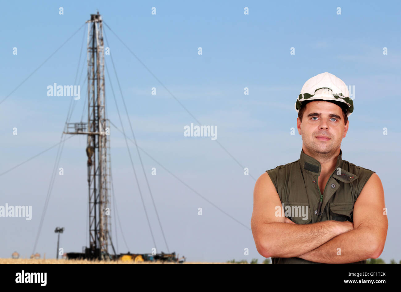 oil worker and oil rig Stock Photo