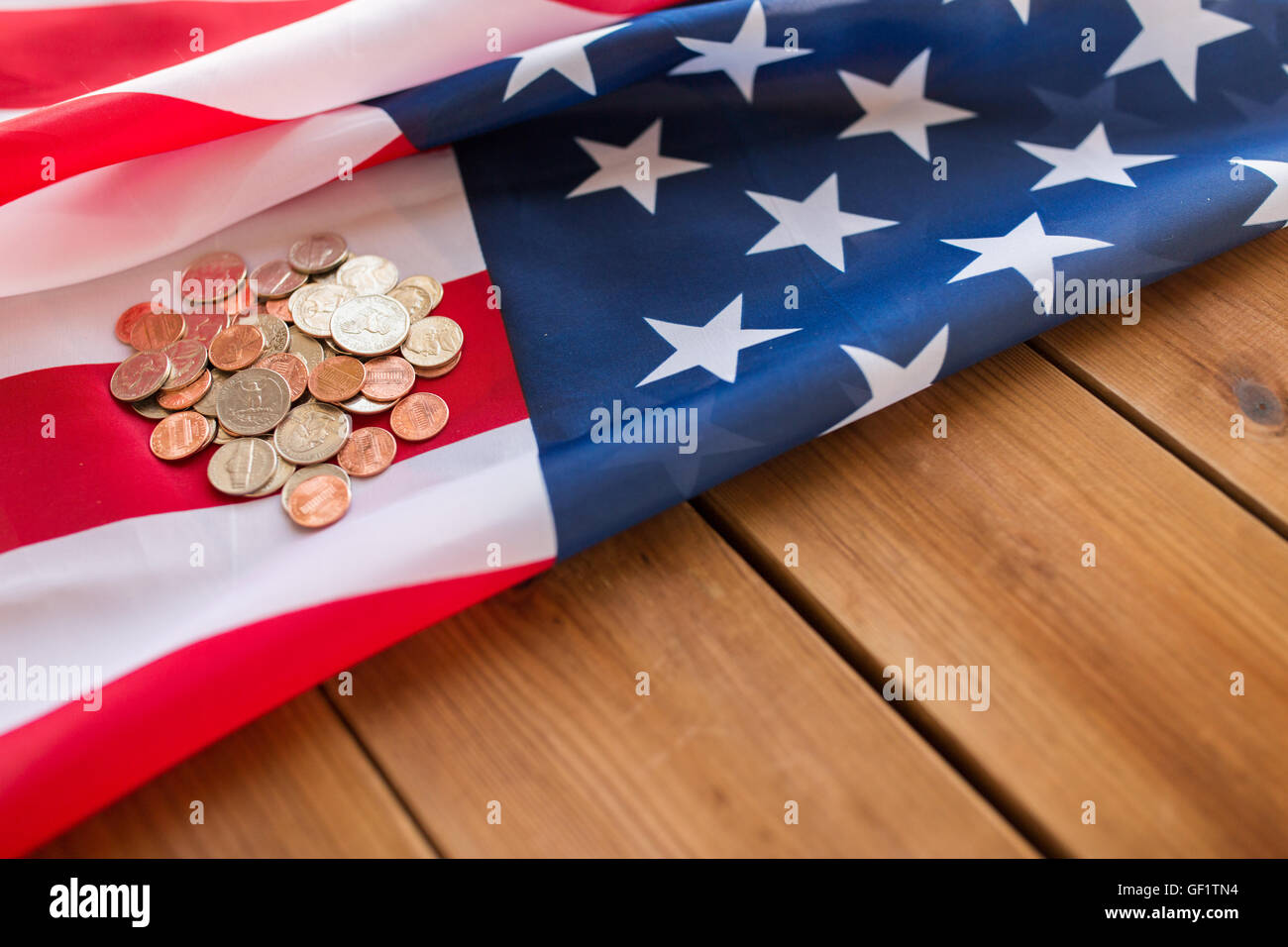 close up of american flag and money on wood Stock Photo