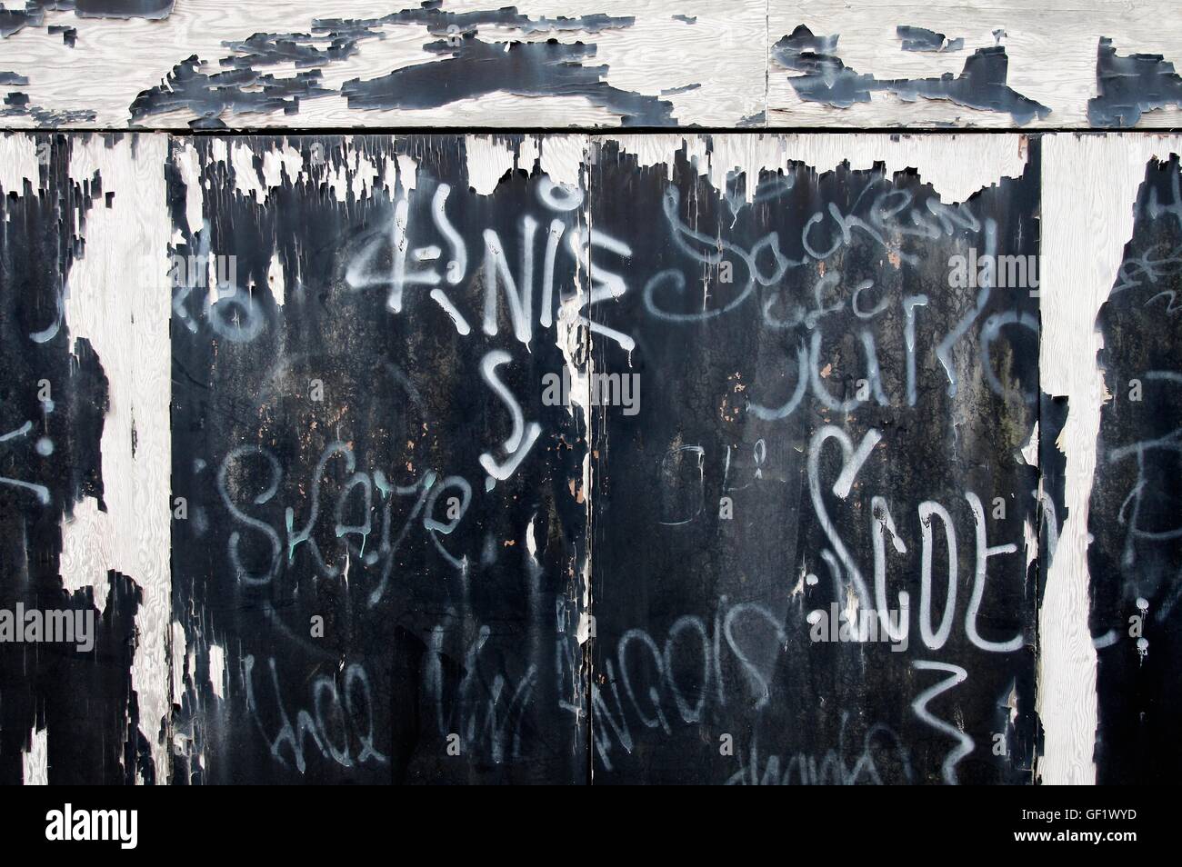 Urban garage doors with peeling paint and graffiti Stock Photo Alamy
