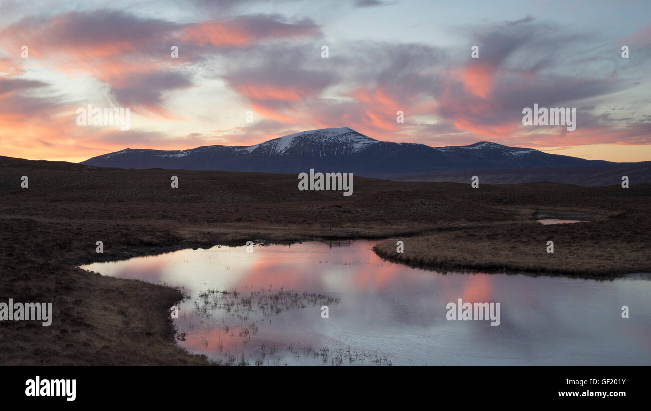 Sunrise colours over Ben Klibreck mountain in Sutherland, Scottish Highlands, Scotland UK Stock Photo