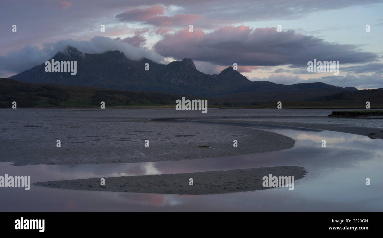 Cloud begins to cover the mountain Ben Loyal in Sutherland after sunset, Scottish Highlands, UK Stock Photo