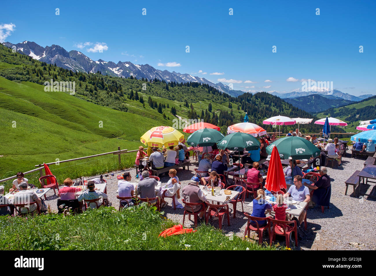 Restaurant terrace at Col des Annes with the Chaîne des Aravis beyond. Le Grand Bornand, Haute-Savoie, France. Stock Photo