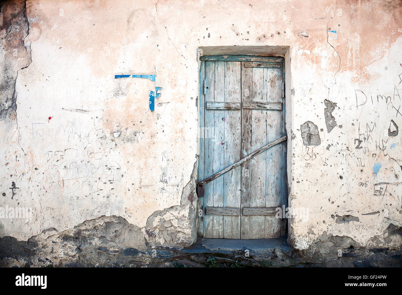 Old blue door of a abandoned house Stock Photo - Alamy