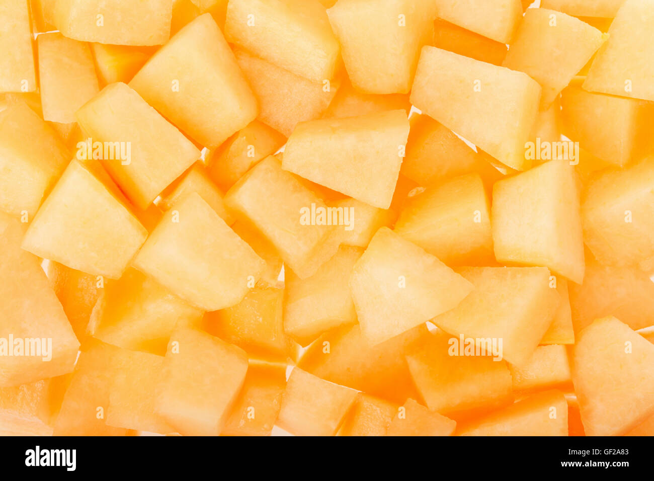 Cantaloupe melon chunks texture background Stock Photo