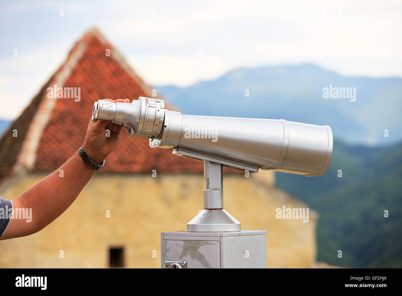 Large coin operated telescope used for viewing mountains Stock Photo