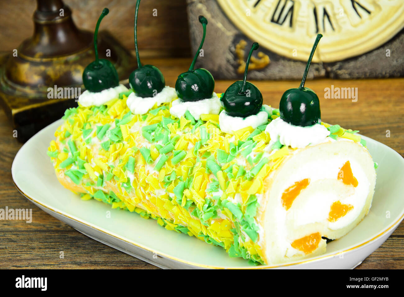 Sponge Roulade with Cream, Mandarin and Cherry Stock Photo - Alamy
