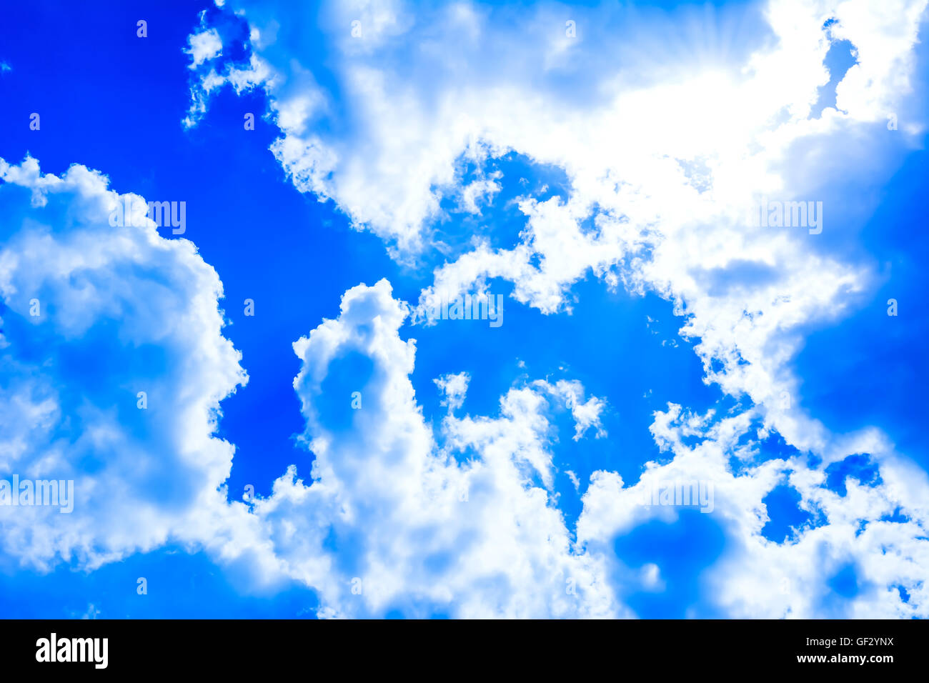 Idyllic beautiful cloudy blue sky background. Clear blue sky with fluffy clouds. Stock Photo