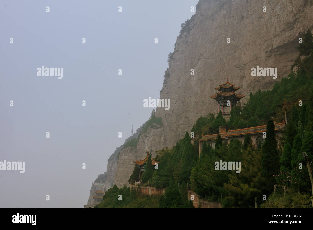 Buddhist Temple Along the Cliff Face at Mianshan, Shanxi, China Stock Photo