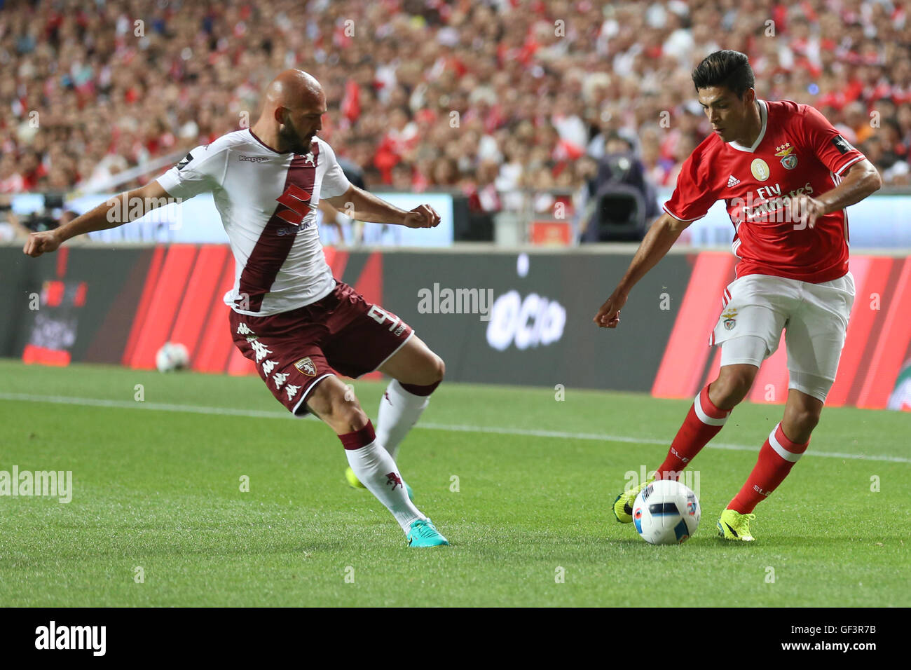 Lisbon, Portugal. 27th July, 2016. SL Benfica's forward from Mexico Raul Jimenez tried to avoid the tackle of Torino's defender Arlind Ajeti Credit:  Alexandre Sousa/Alamy Live News Stock Photo