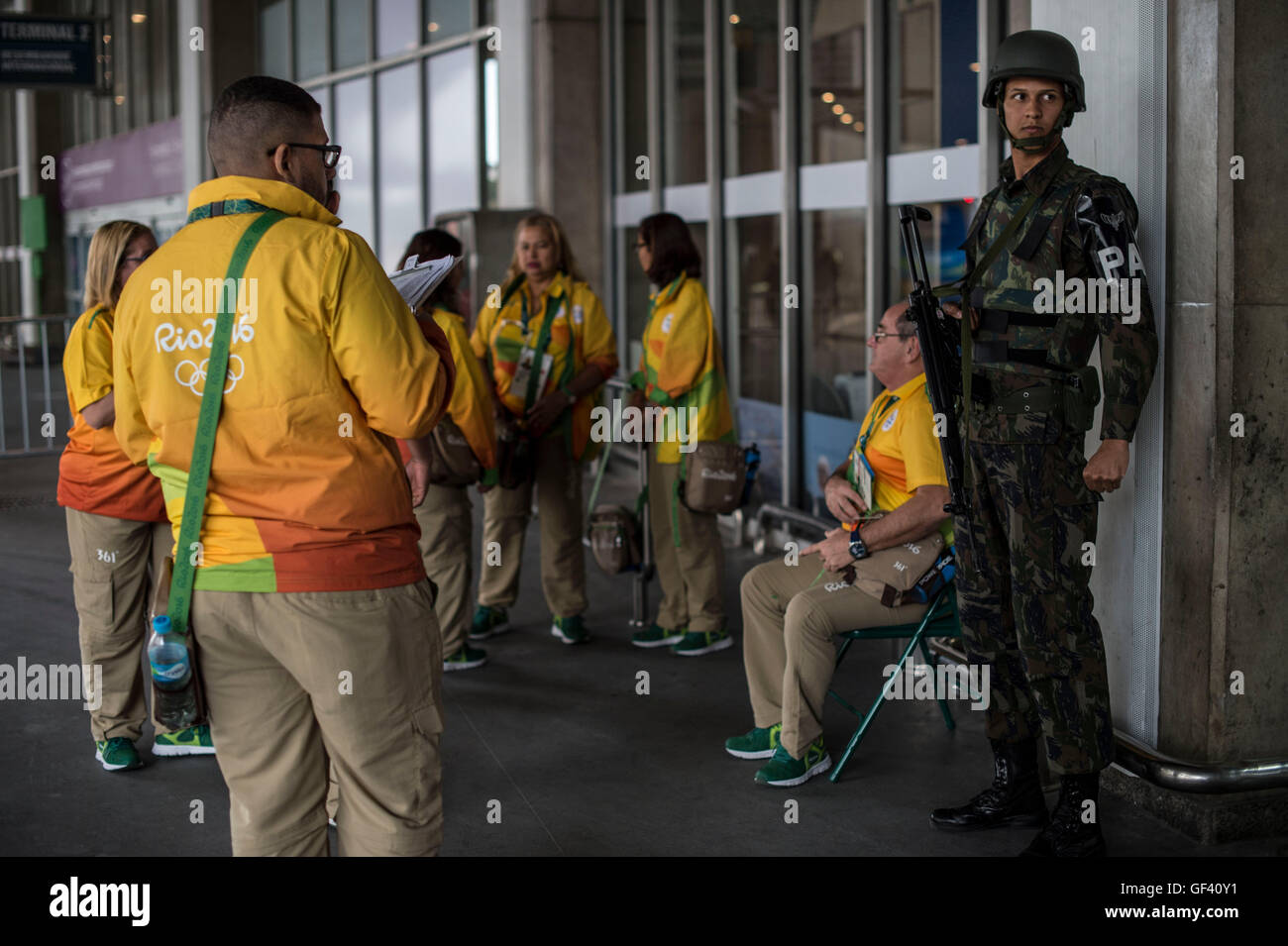 Rio De Janeiro, Brazil. 28th July, 2016. A soldier (R) stands guard at Rio International Airport in Rio de Janeiro, Brazil, July 28, 2016. South America's largest country will deploy 88,000 soldiers and police during the Olympics, more than double the number at the London 2012 Games. © Lui Siuwai/Xinhua/Alamy Live News Stock Photo