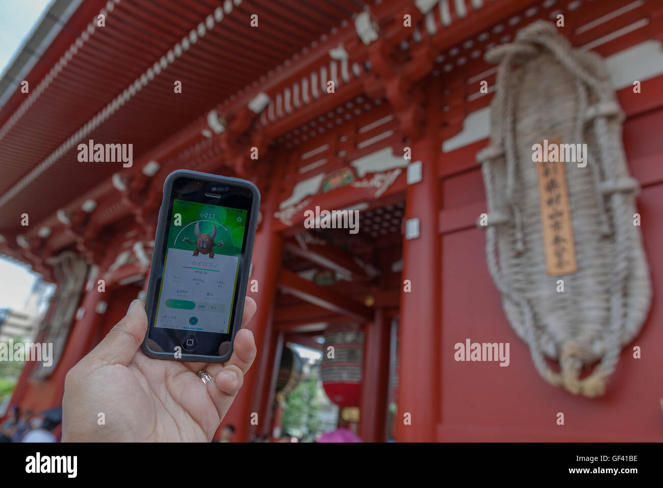 A Man Shows The Pokemon Character Pinsir Catch At The Entrance Of The Sensoji Temple In Asakusa On July 28 16 Tokyo Japan Within Three Days Of The Launch Of Pokemon Go