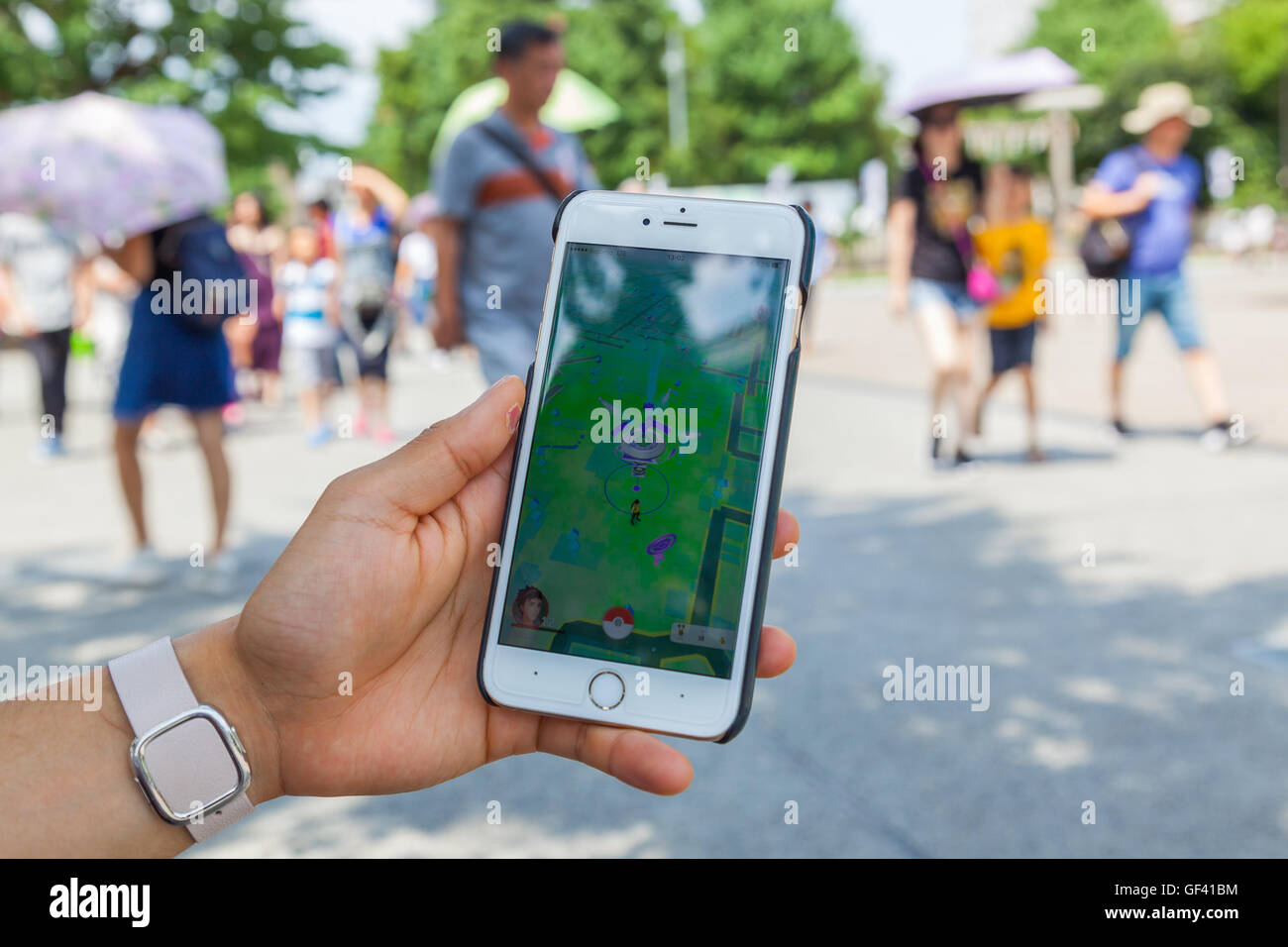A Man Uses A Gps Controller In Pokemon Go Game At The Sensoji Temple Stock Photo Alamy