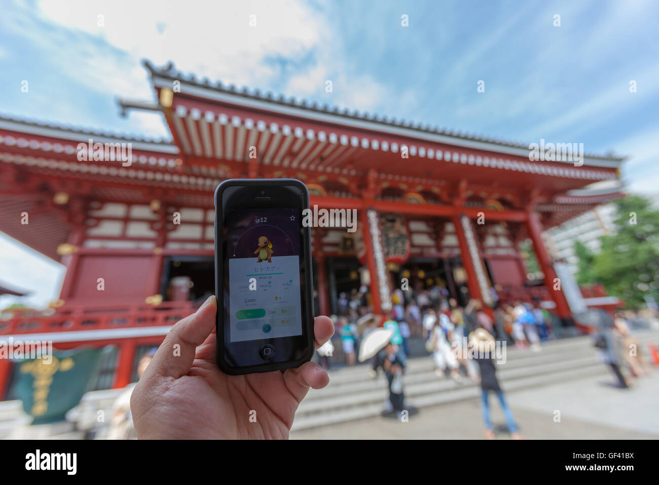 A Man Shows The Pokemon Character Charmander Catch At The Sensoji Temple In Asakusa On July 28 16 Tokyo Japan Within Three Days Of The Launch Of Pokemon Go The National Police