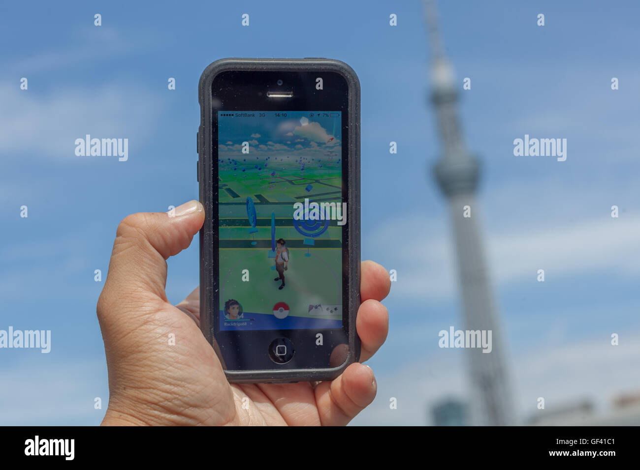 A man uses a GPS Controller in Pokemon GO game near to the Sumida River in  Asakusa district on July 28, 2016, Tokyo, Japan. Within three days of the  launch of Pokemon