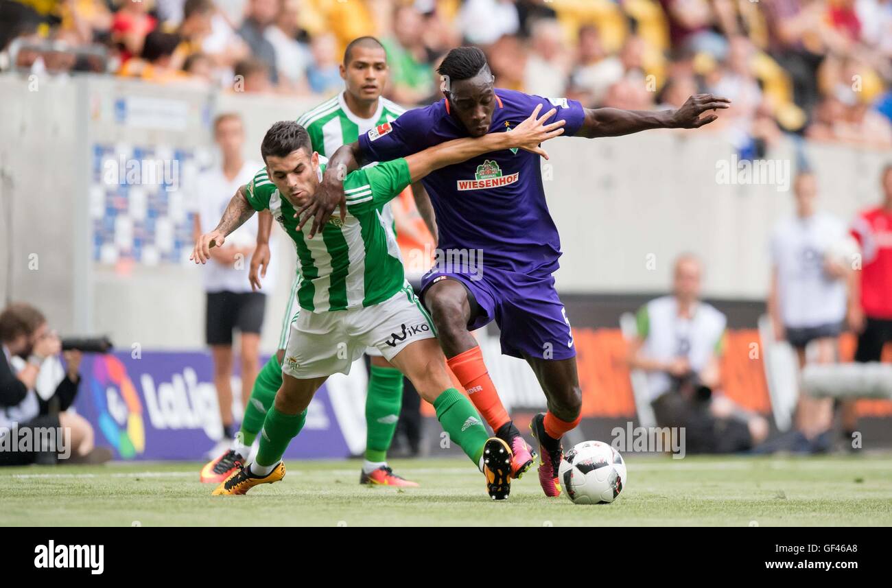 Dresden, Germany. 29th July, 2016. Bremen's Sambou Yatabare (r) and Sevilla's Alex Martinez in action during the Dresden Cup soccer match between SV Werder Bremen and Real Betis Sevilla at DDV stadium in Dresden, Germany, 29 July 2016. PHOTO: THOMAS EISENHUTH/dpa/Alamy Live News Stock Photo